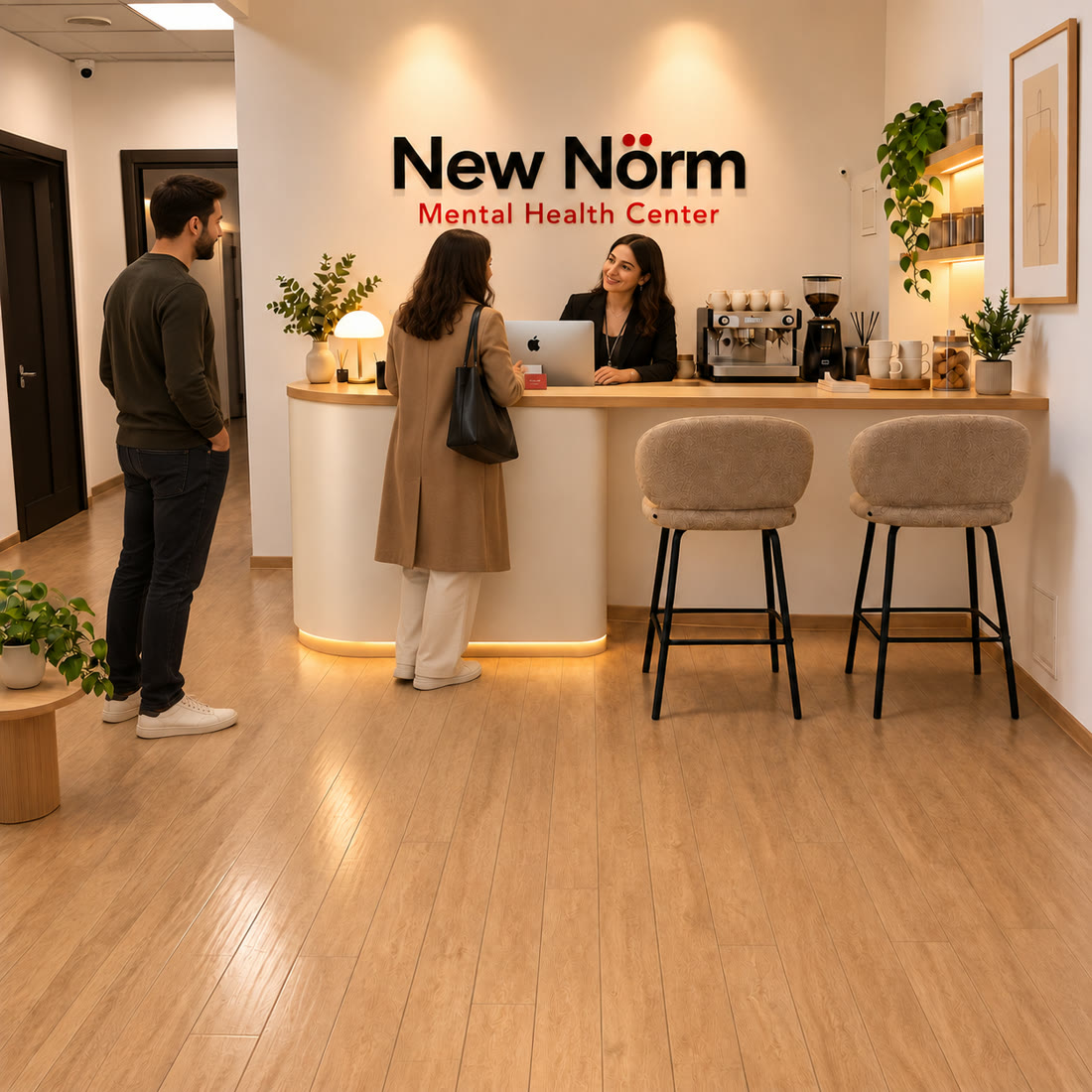 A visitor is welcomed at the New Nörm Centre reception desk